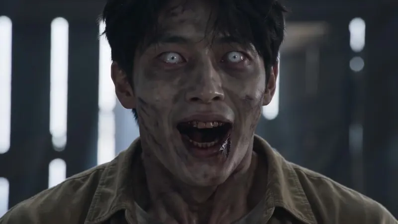 Extreme close-up of the zombie with ashen skin and white eyes
